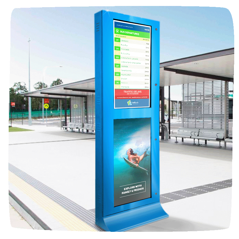 A bus stop with a large pillar displaying two screens on top of each other. Top screen showing the bus timetable and bottom displaying community advertising