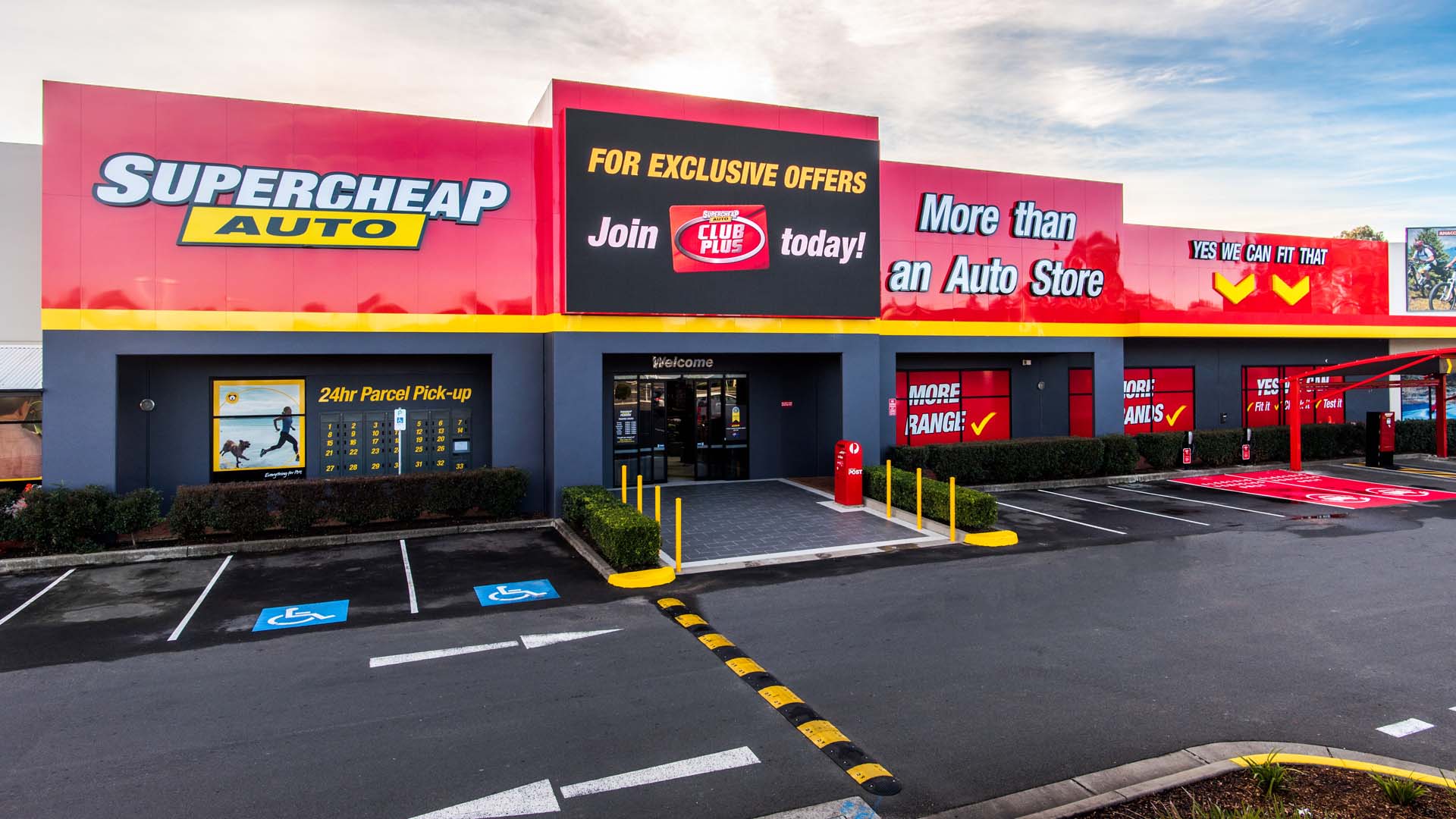 A picture of an LED display at Supercheap Auto shop from the outside facing the store.